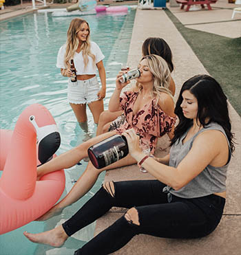 girls in a bachelorette party by the pool
