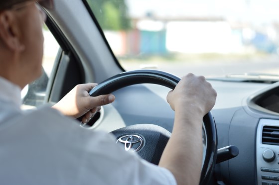 chauffeur driving a car